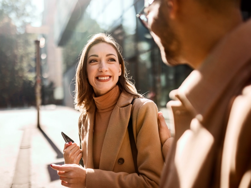 young woman smiling at man