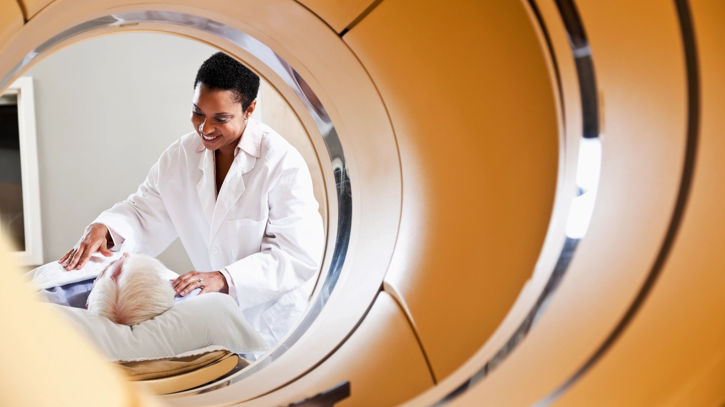 Medical scanning machine with patient and doctor in the back ground image